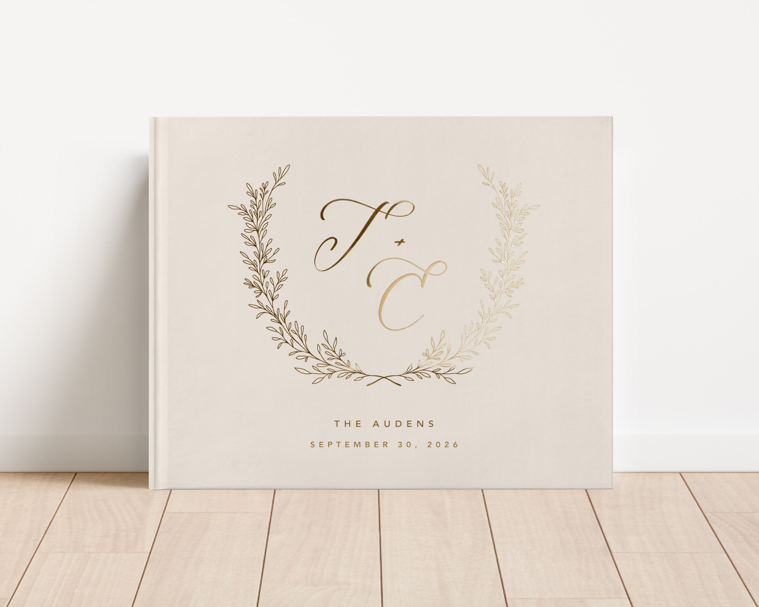 Custom hardback wedding guest book personalized with luxury gold foil text.