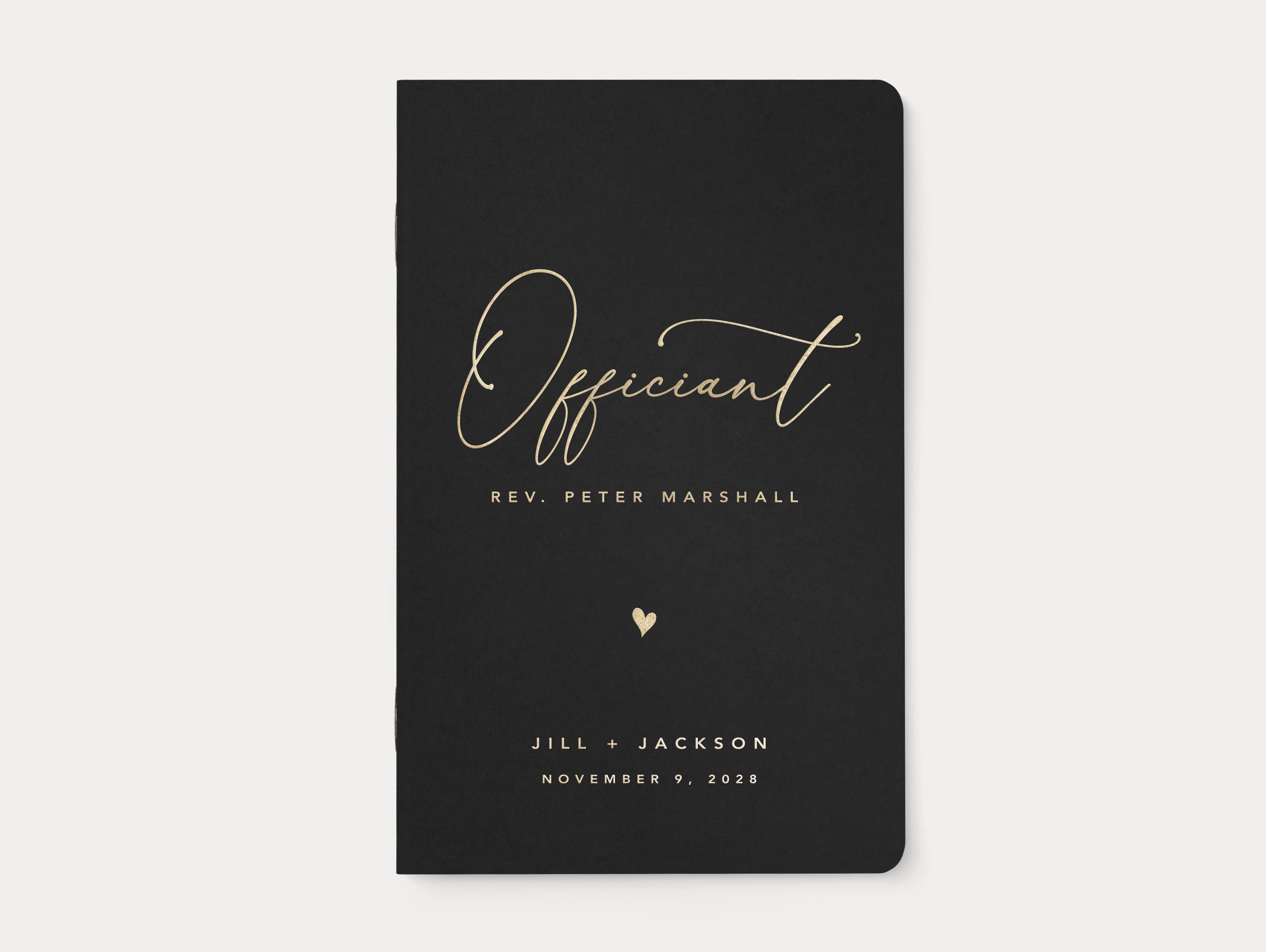 Personalized wedding officiant script book with heart.