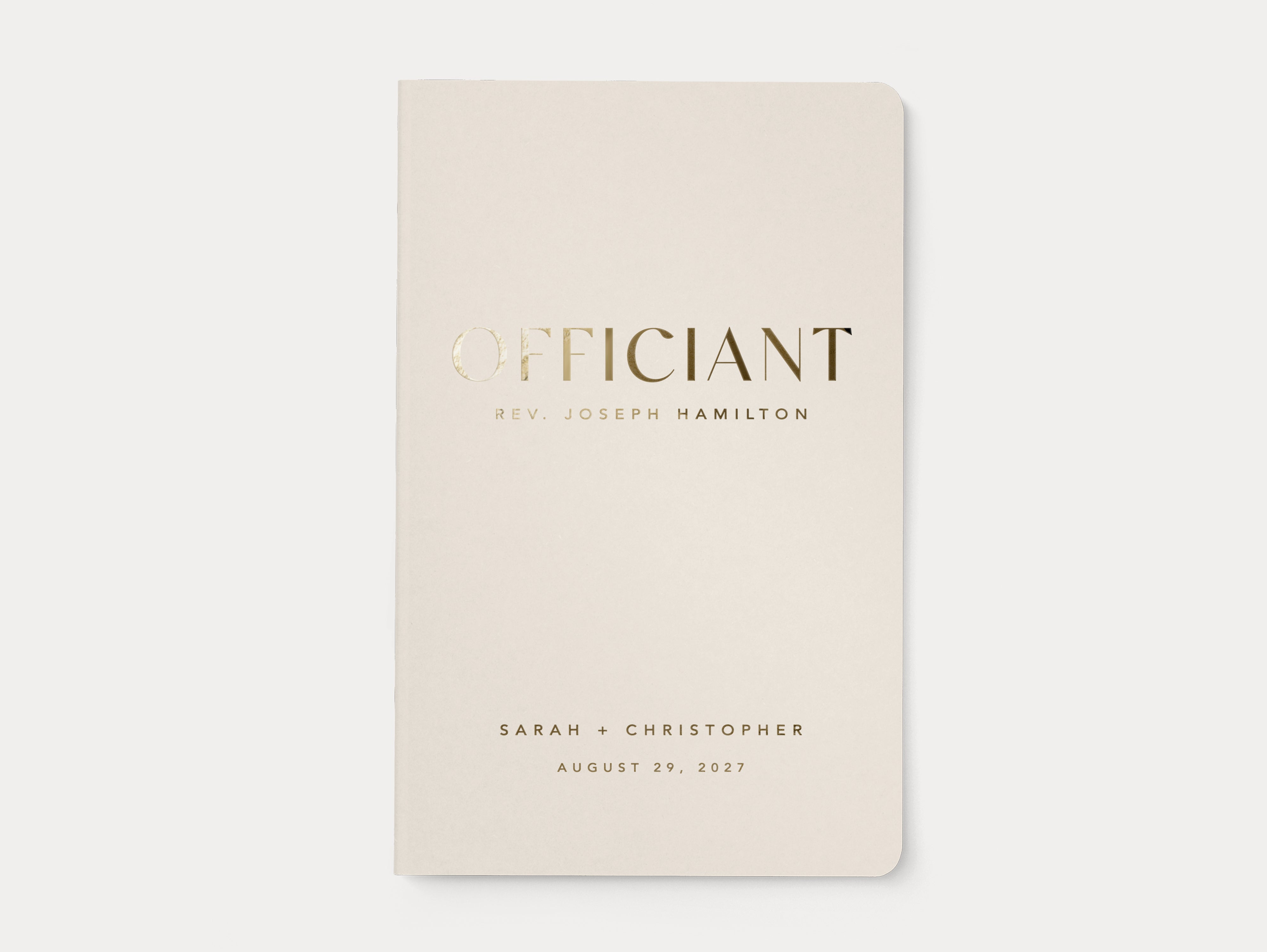 Minimal wedding officiant booklet with gold foil lettering.