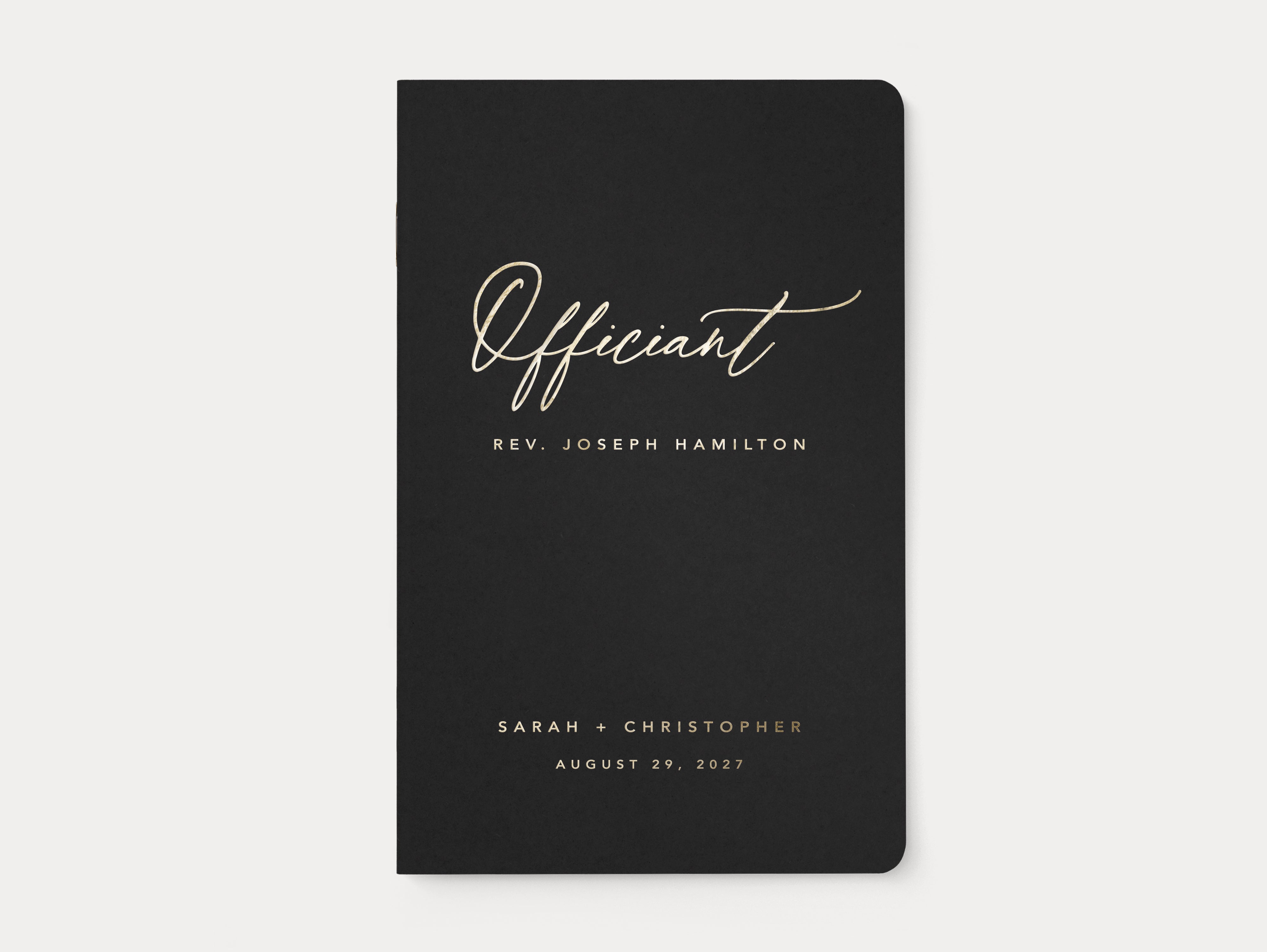Black officiant ceremony book with custom gold foil lettering.
