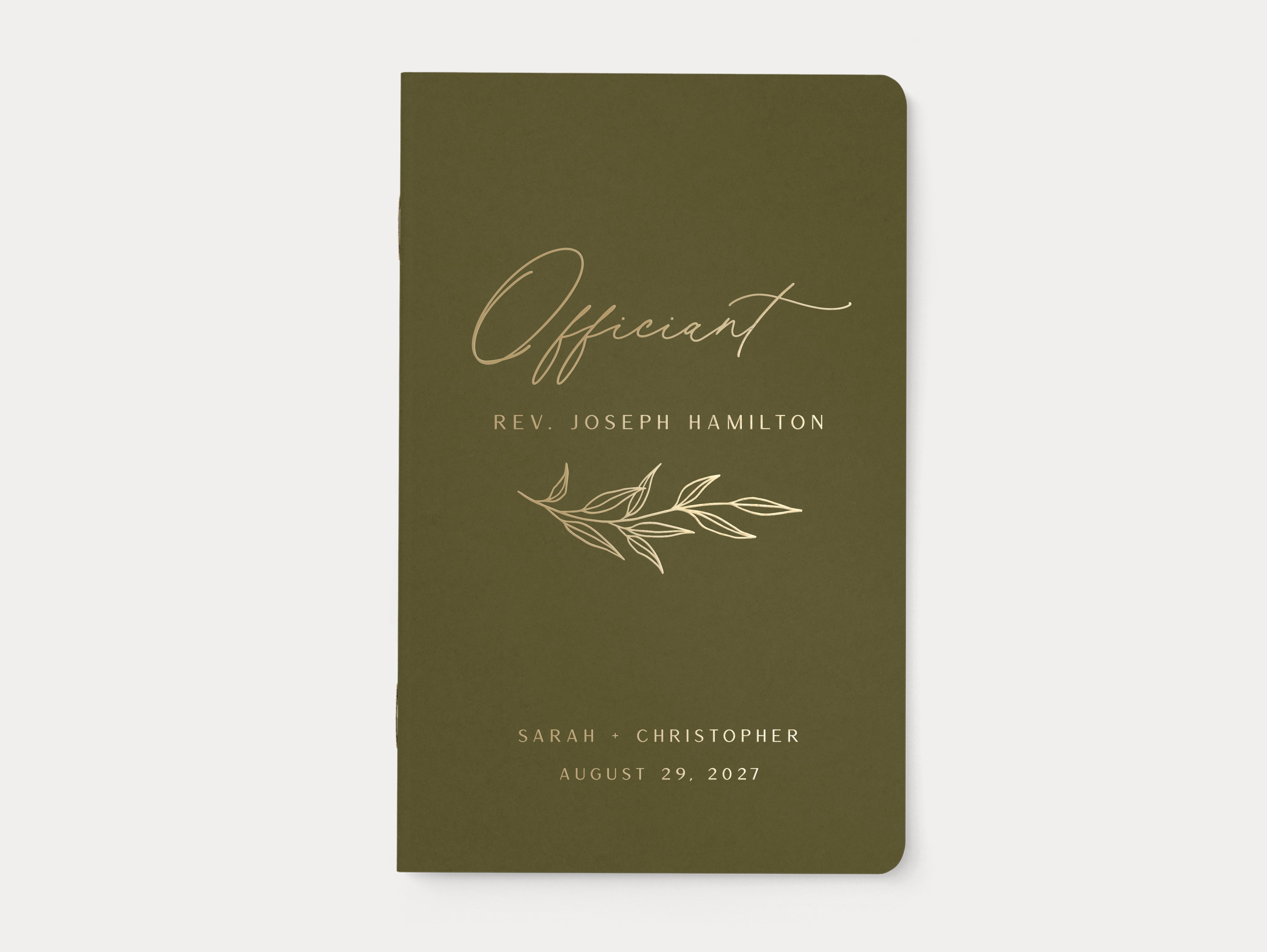 Personalized officiant booklet with leaf graphic.