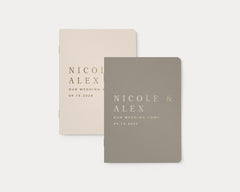 Luxury personalized vow book pair with gold foil text.