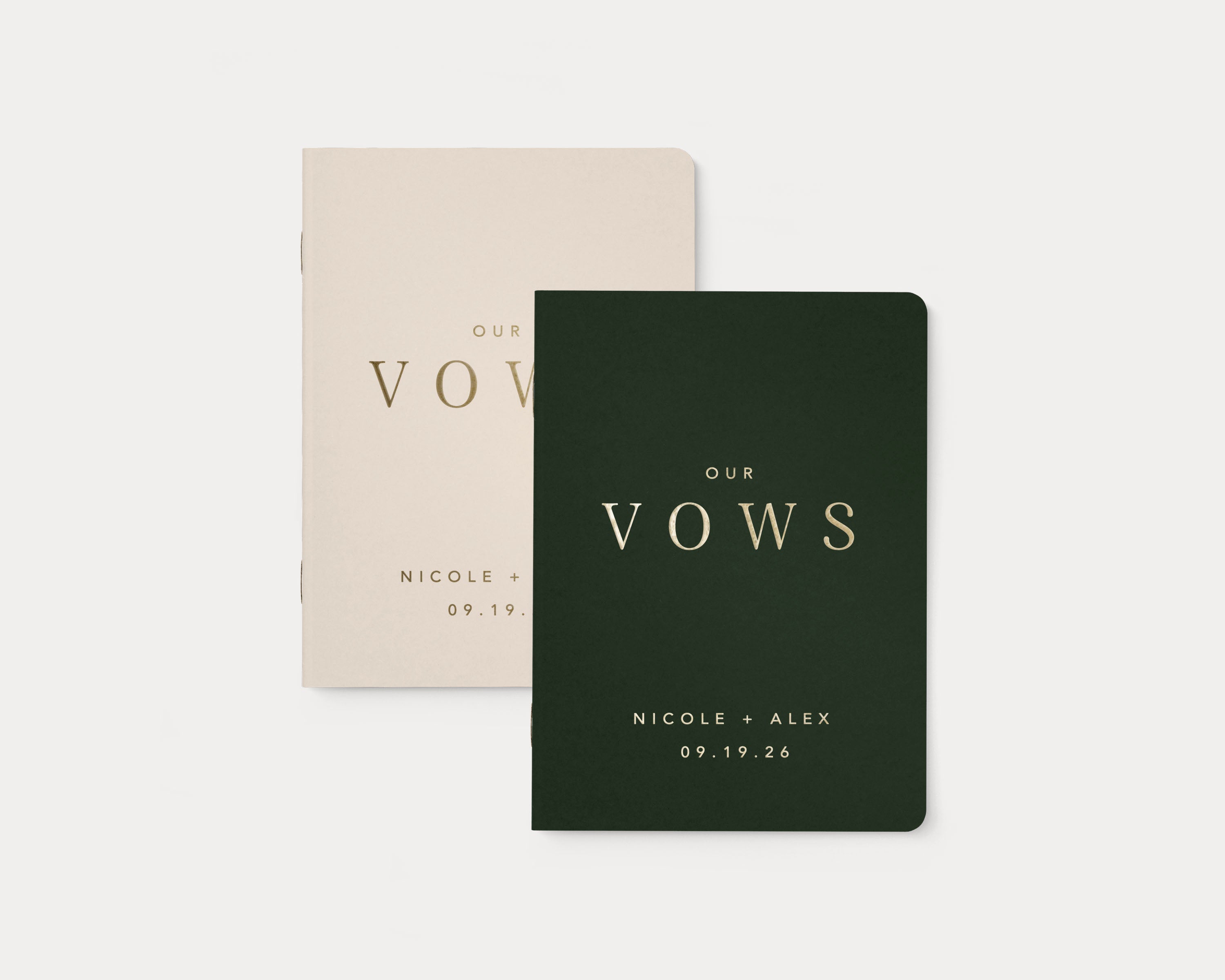 Set of 2 wedding vow books with gold foil personalization.