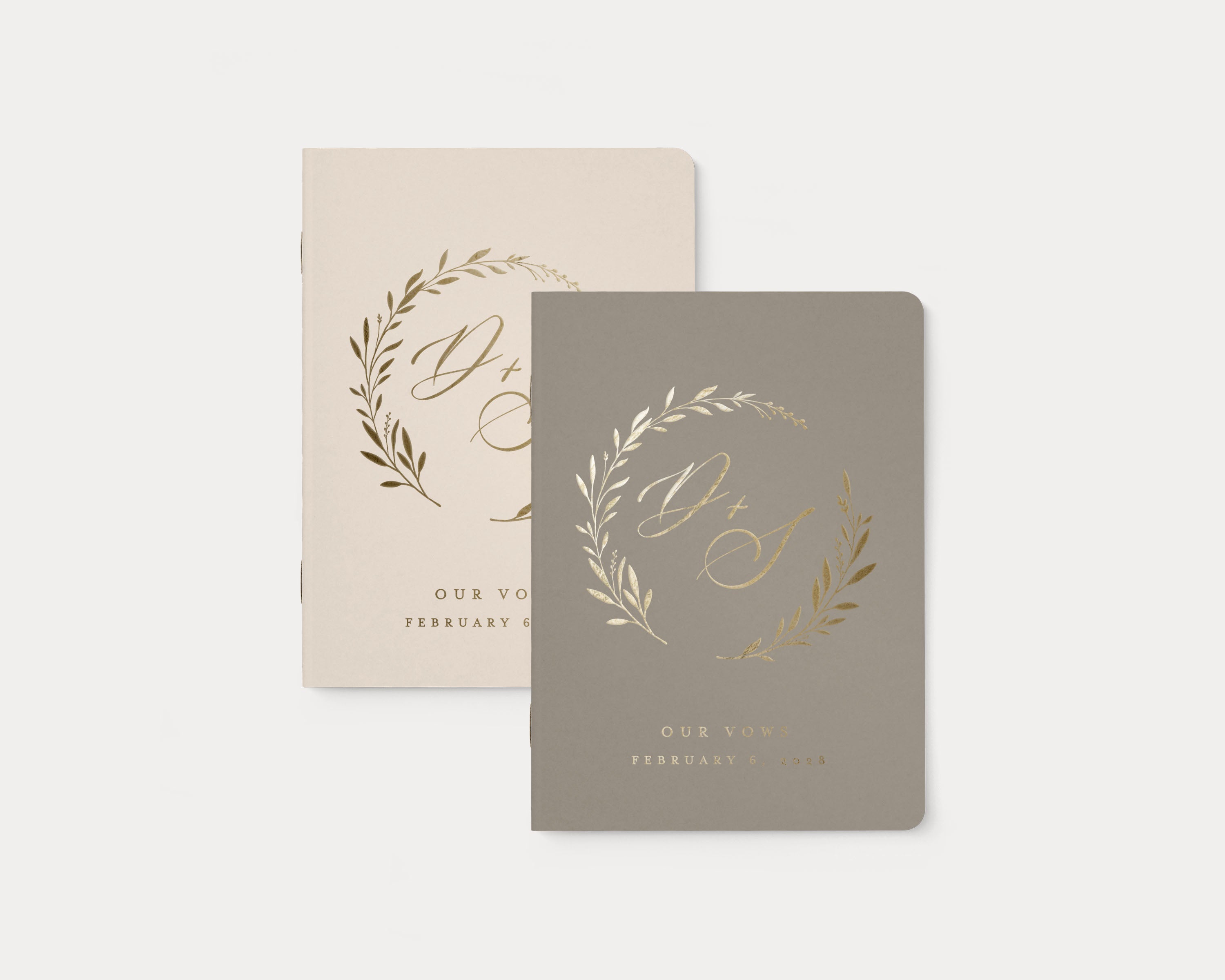 Luxury personalized vow book pair with gold foil text.