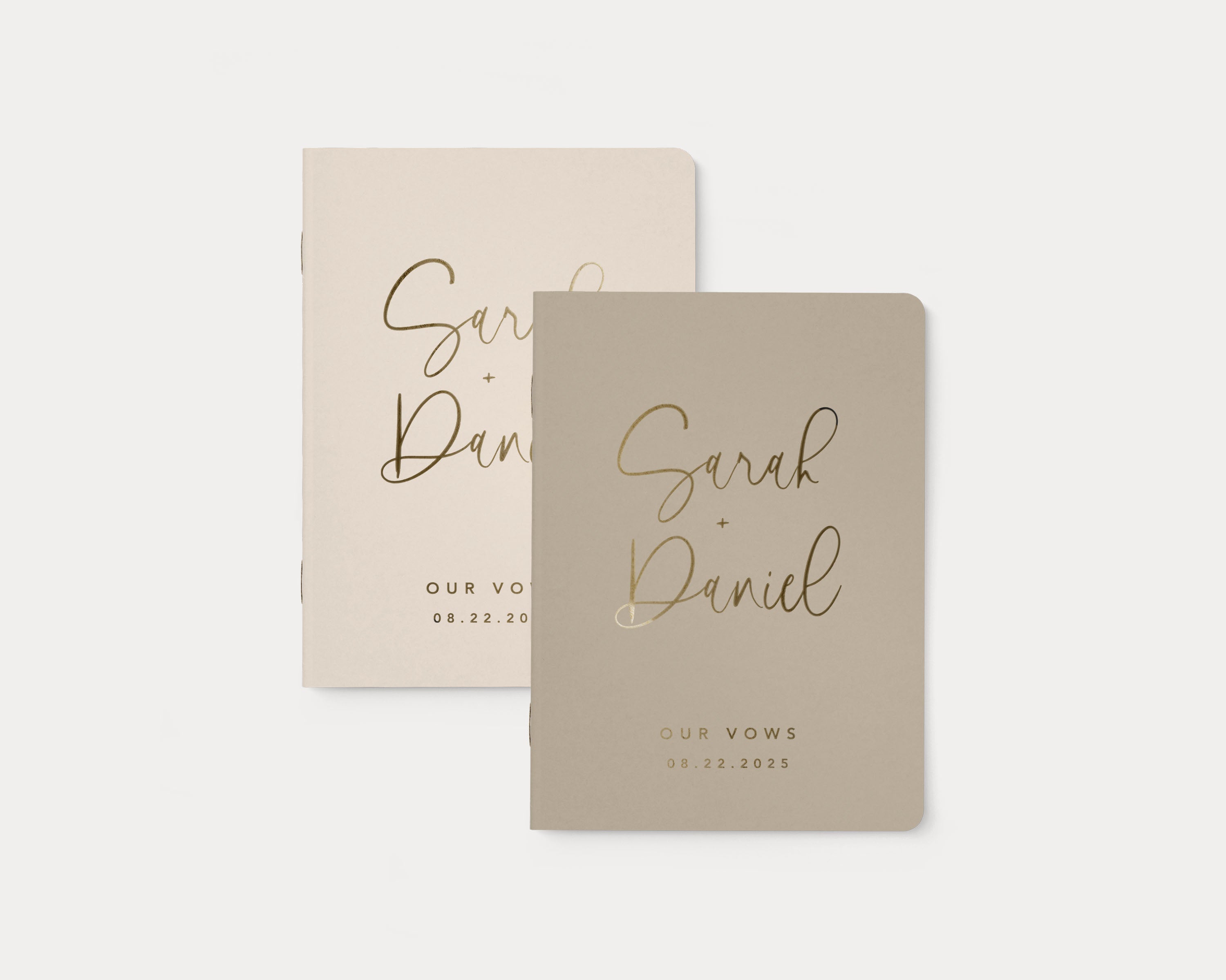 Luxury personalized vow book pair with gold foil text.