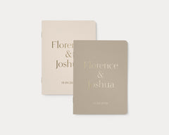 Set of 2 wedding vow books with gold foil personalization.