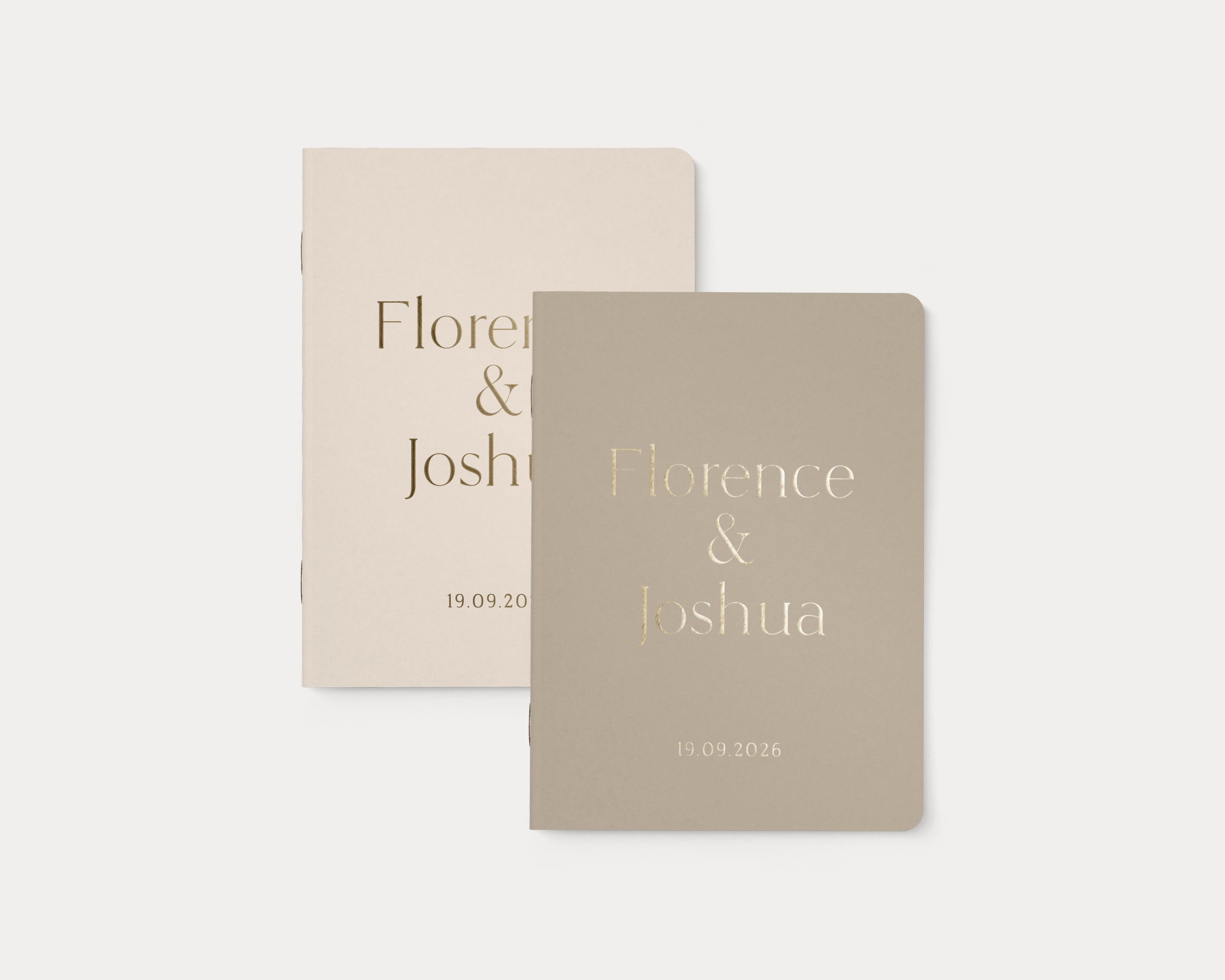 Set of 2 wedding vow books with gold foil personalization.