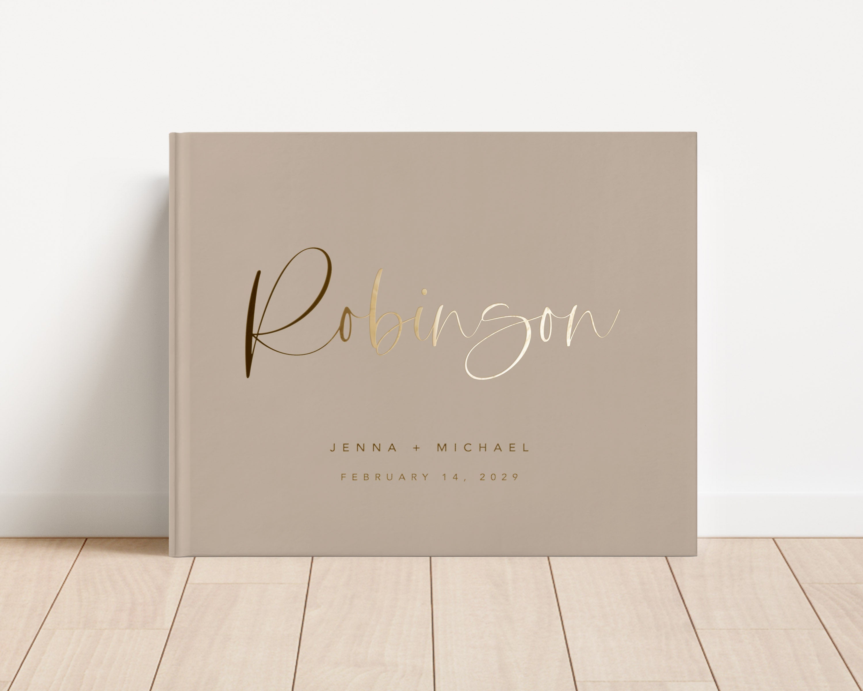 Custom hardback wedding guest book personalized with luxury gold foil text.