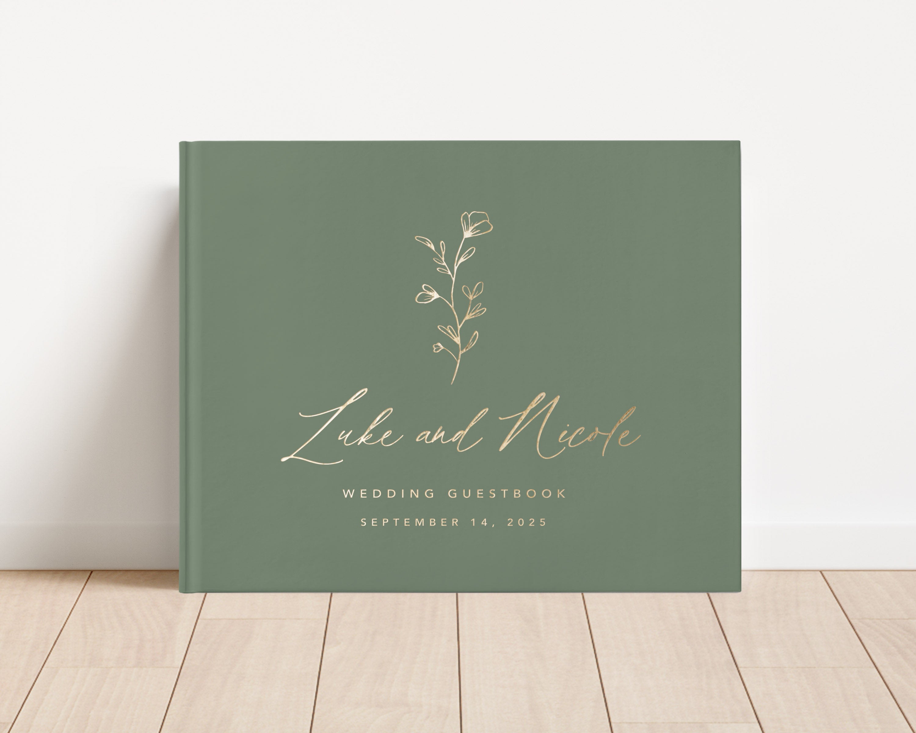 Luxury wedding guest book with custom gold foil text and sage hardback cover.