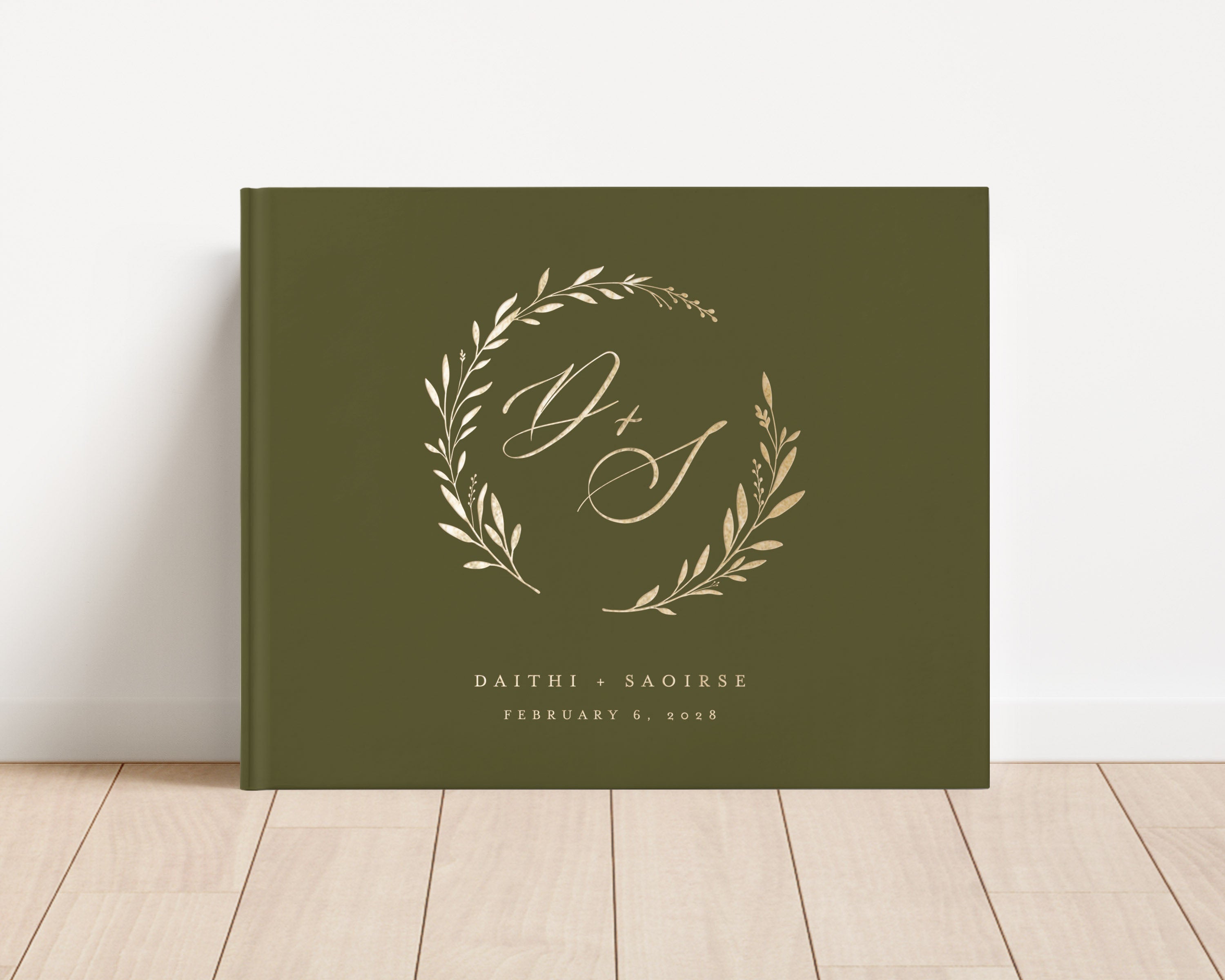 Custom hardback wedding guest book personalized with luxury gold foil text.