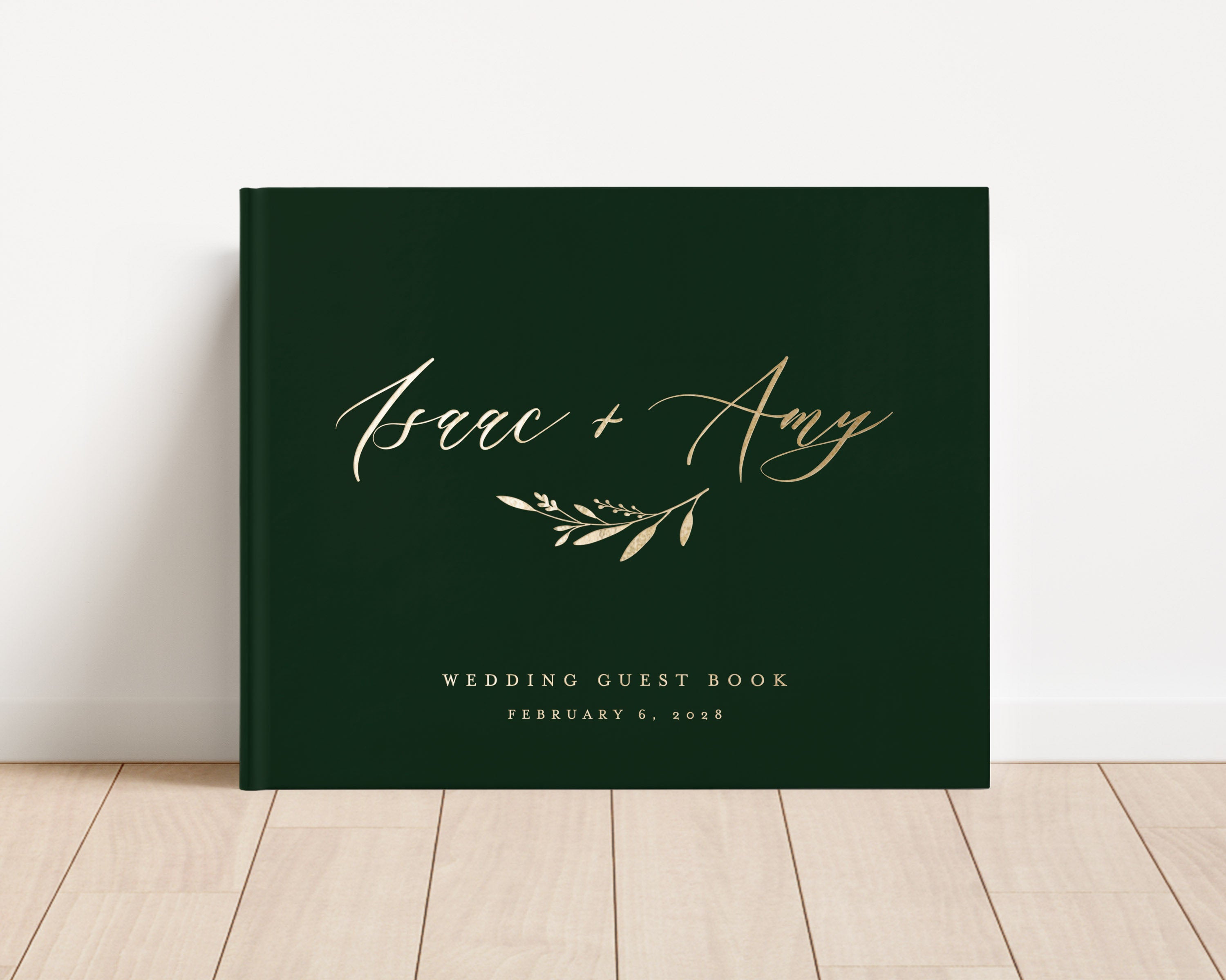 Custom hardback wedding guest book personalized with luxury gold foil text.