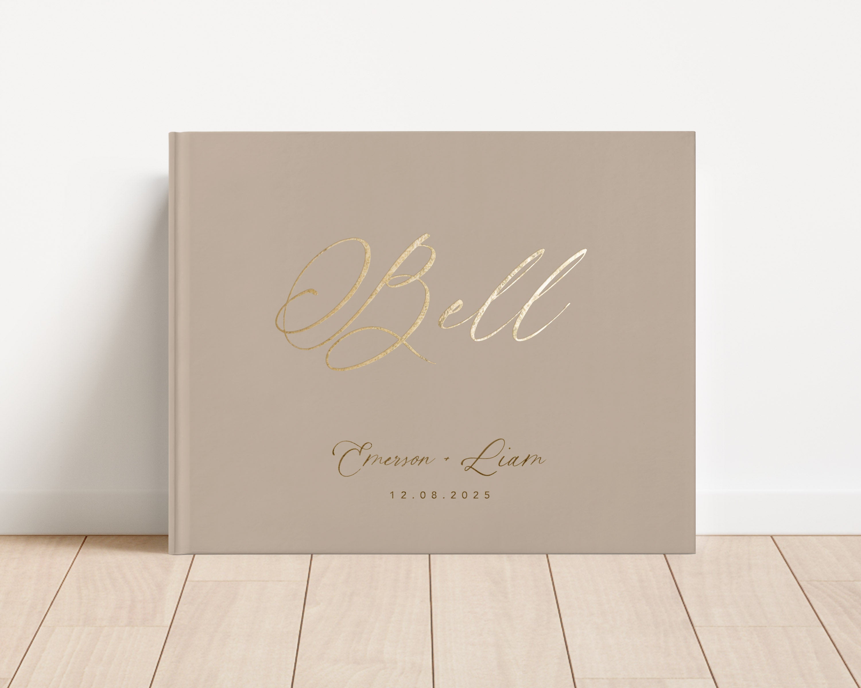 Custom hardback wedding guest book personalized with luxury gold foil text.
