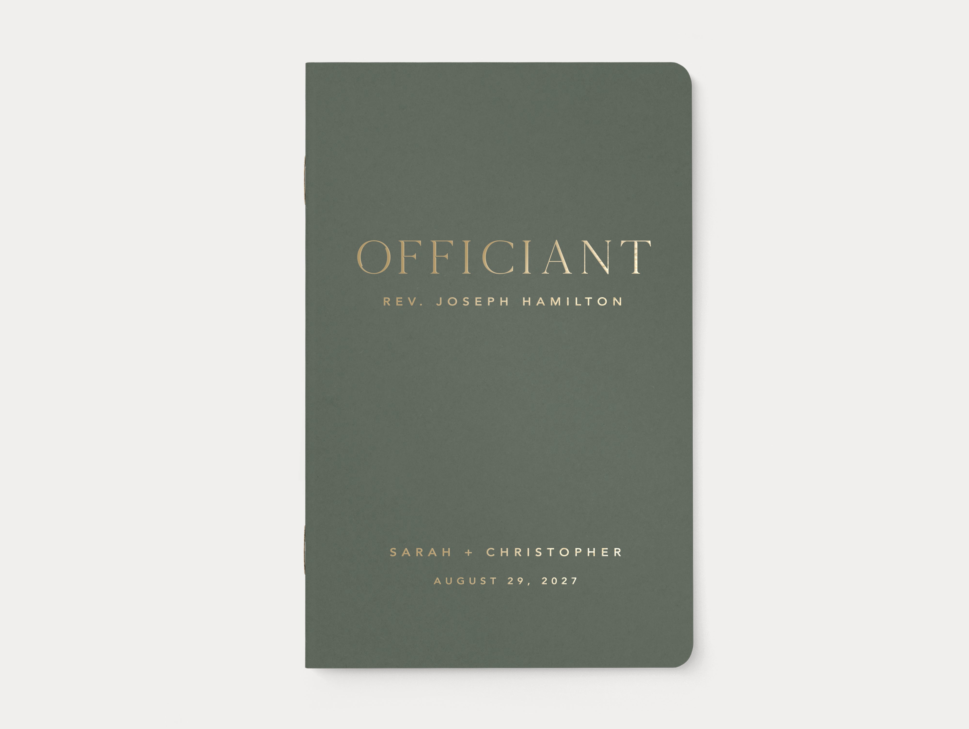 Custom wedding officiant script book with gold foil.