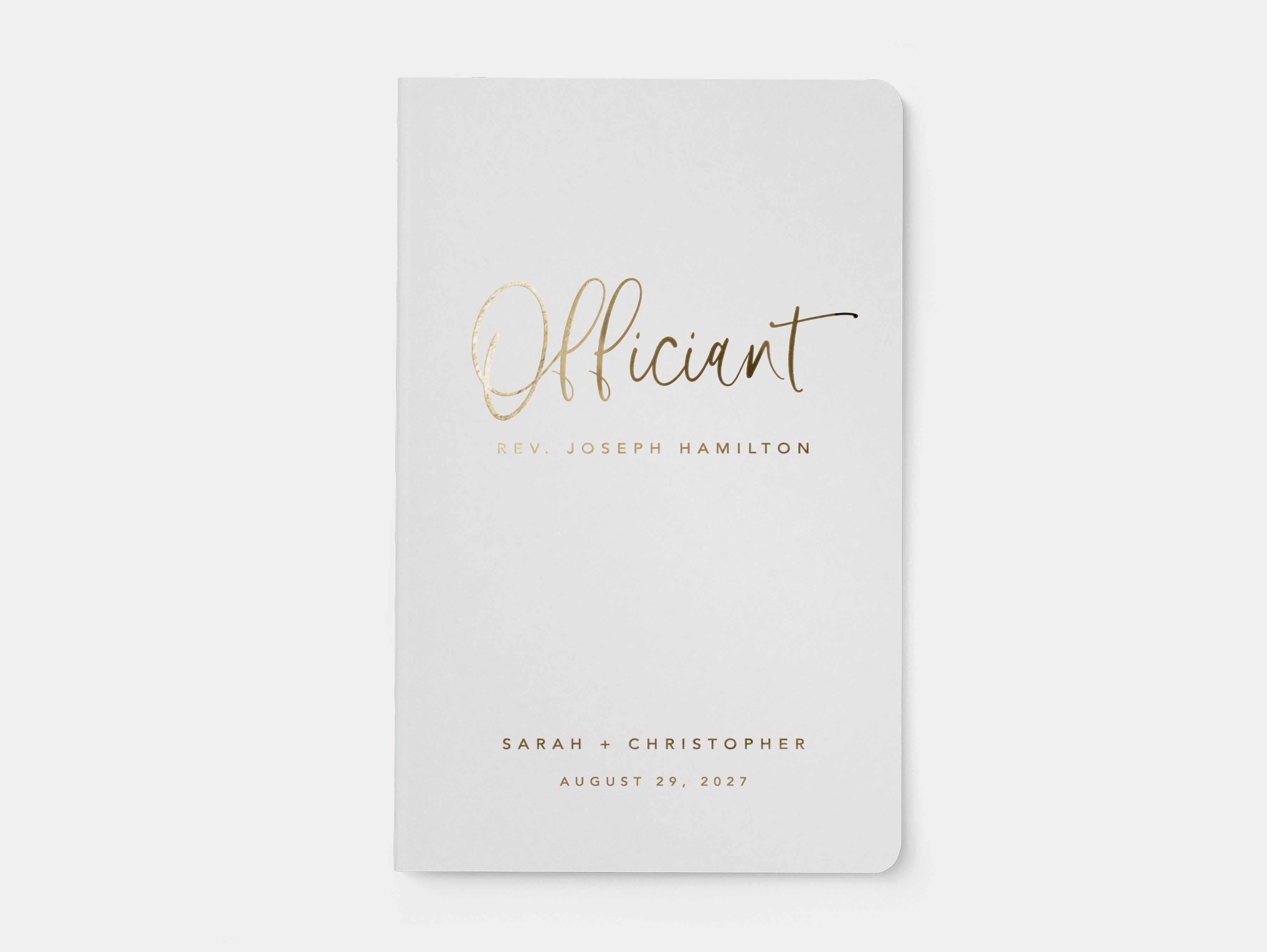 Gold foil officiant book for ceremony.