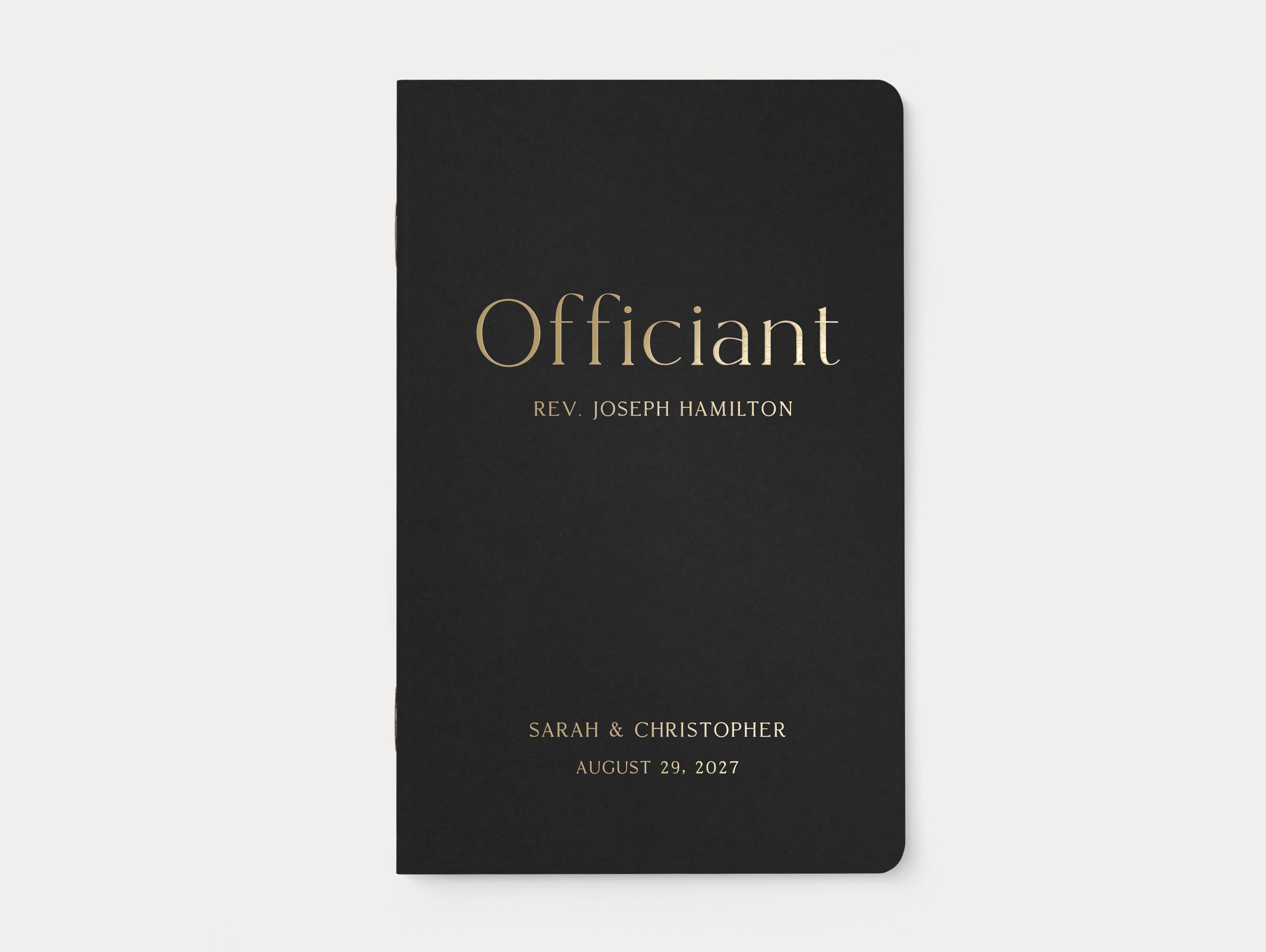 Custom black wedding officiant booklet with gold foil.