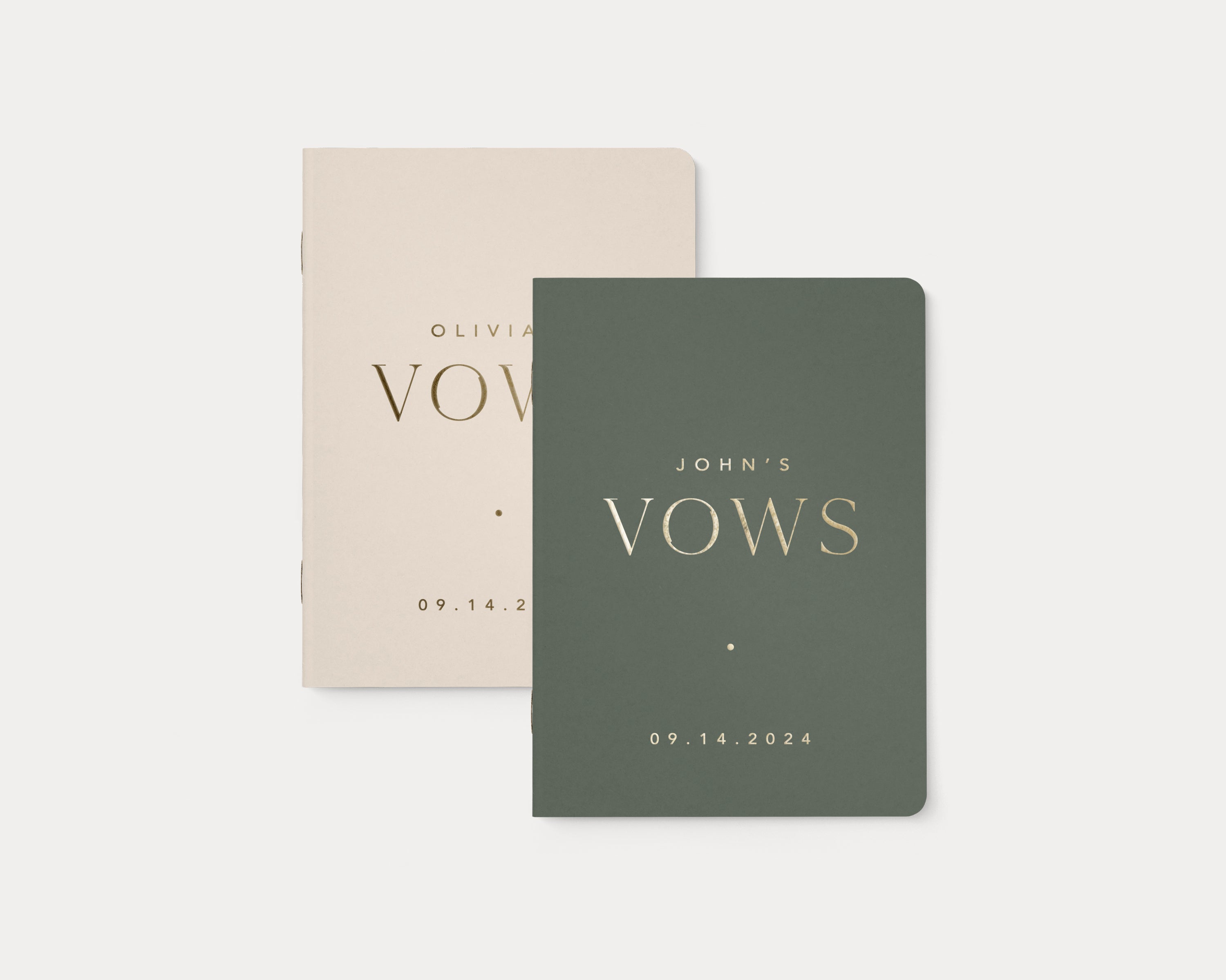 Almond and moss wedding vow books with custom gold foil lettering.