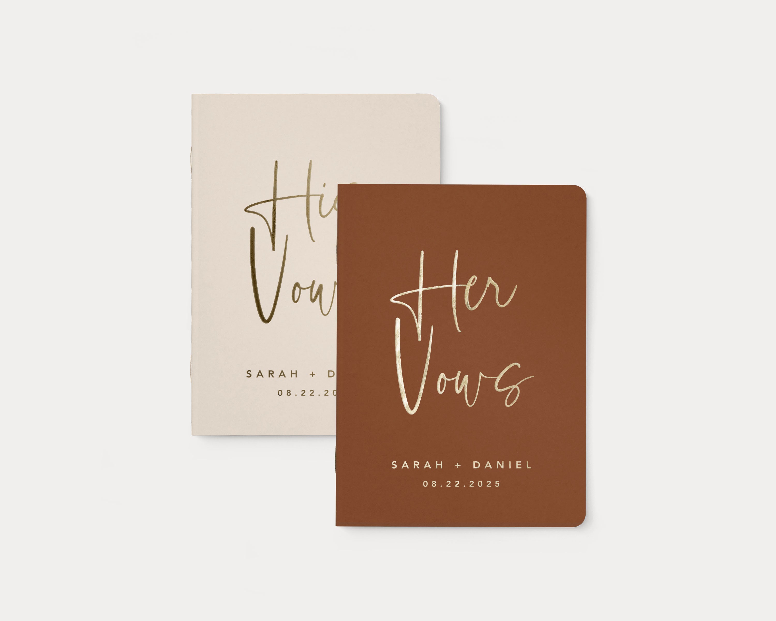 Set of 2 wedding vow books with gold foil personalization.