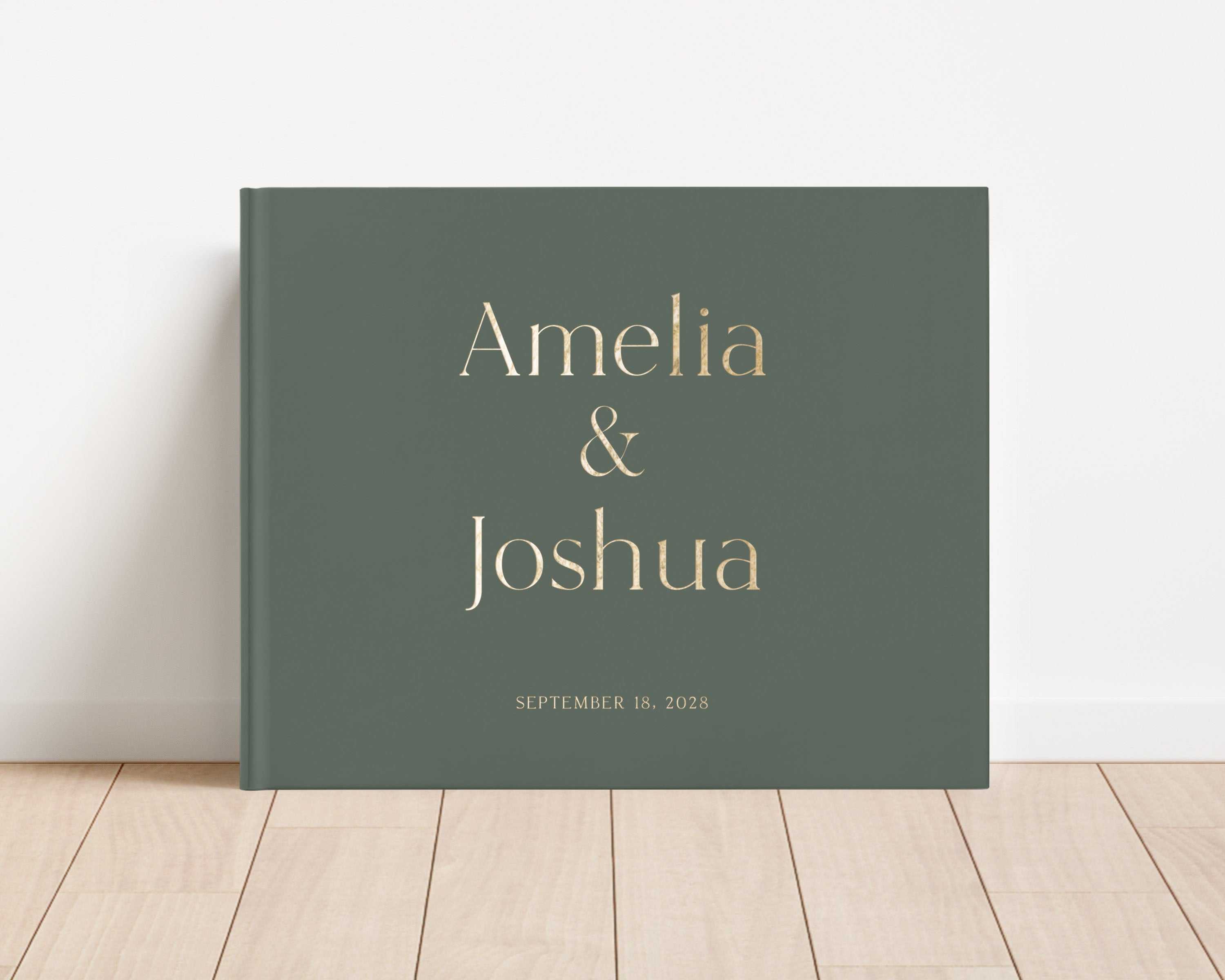 Luxury wedding guest book with custom gold foil text and moss green hardback cover.